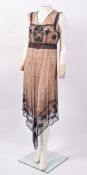 An Art Deco 'flapper' black beaded dress, approximately 142cm overall,