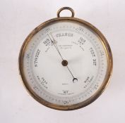 A lacquered brass aneroid barometer, the dial with retailer's mark for ' T & H Doublet, Morgate St',