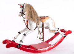 A late Victorian/early Edwardian Rocking Horse of small size inset glass eyes with open mouth,