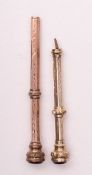 Two Victorian yellow metal seal top propelling toothpicks.
