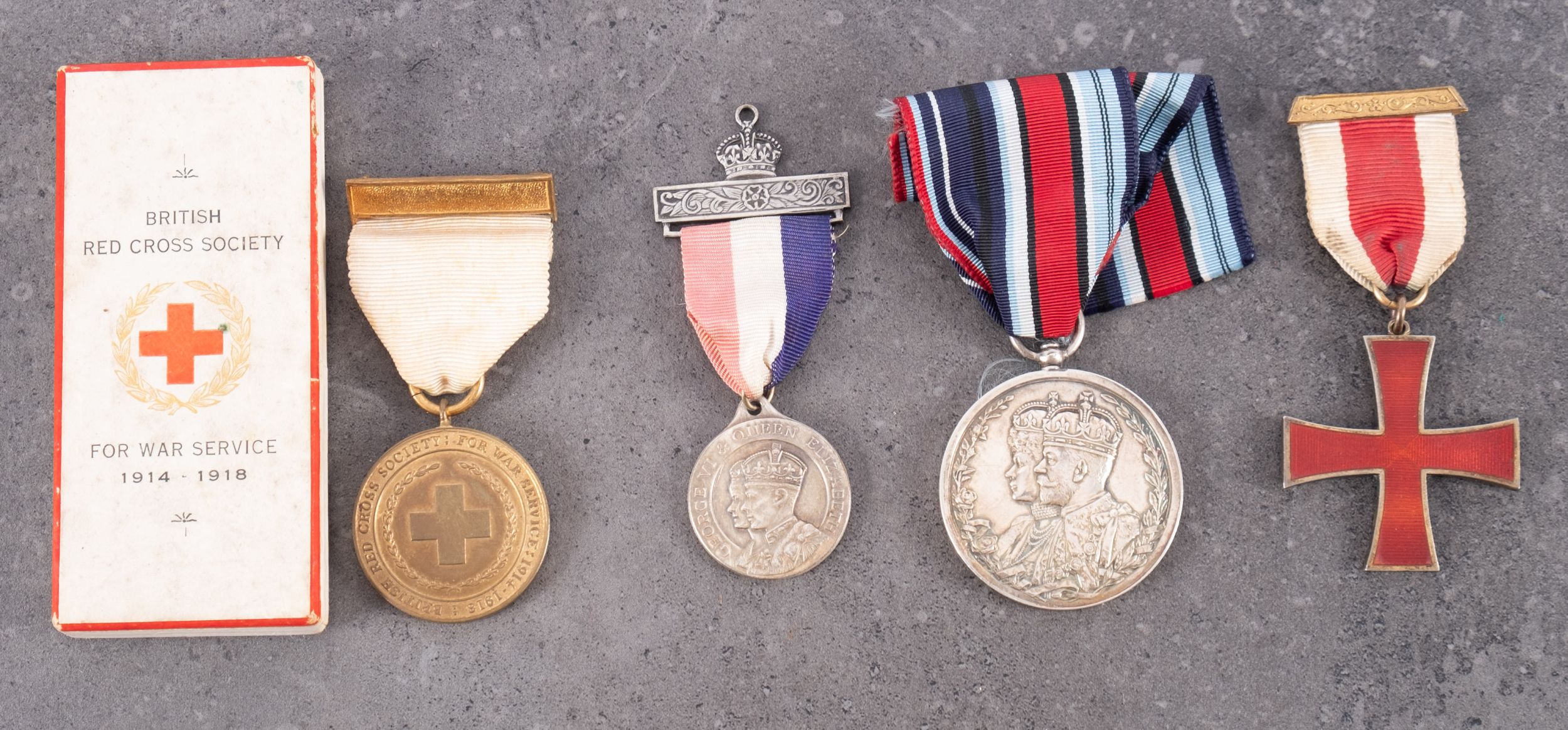 A Delhi Durbar Medal 1911, together with a silver gilt and enamel Red Cross,