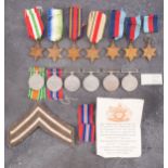 A quantity of WWII service medals.