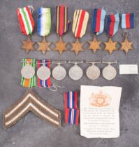 A quantity of WWII service medals.