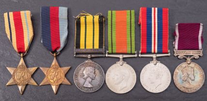 A group of six WWII Medals, comprising of a 1939-45 Star, An Africa Star, Defence medal, War Medal,