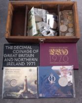 A collection of coins and notes including 1970 and 1971 proof sets, £5 & £2 coins,