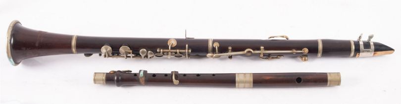 A cocuswood and silver plated clarinet, unsigned 64cm long,