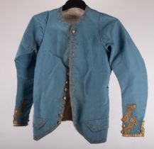 An 18th-century blue satin gentleman's short jacket of smaller proportions, possibly for a youth,