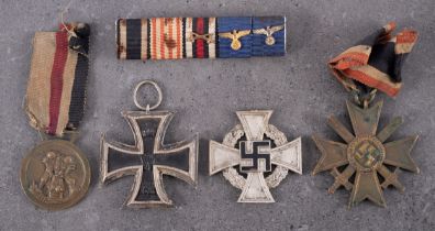 A WWI Iron Cross, second class, together with a WWII German/Italian North Africa Medal,