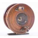 An Anglers Depot Nottingham star back 3 1/2inch fishing reel, mahogany and brass, twin horn handles,