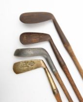 A group of four hickory shaft golf clubs, comprising a Percy Baxter Nilblick,