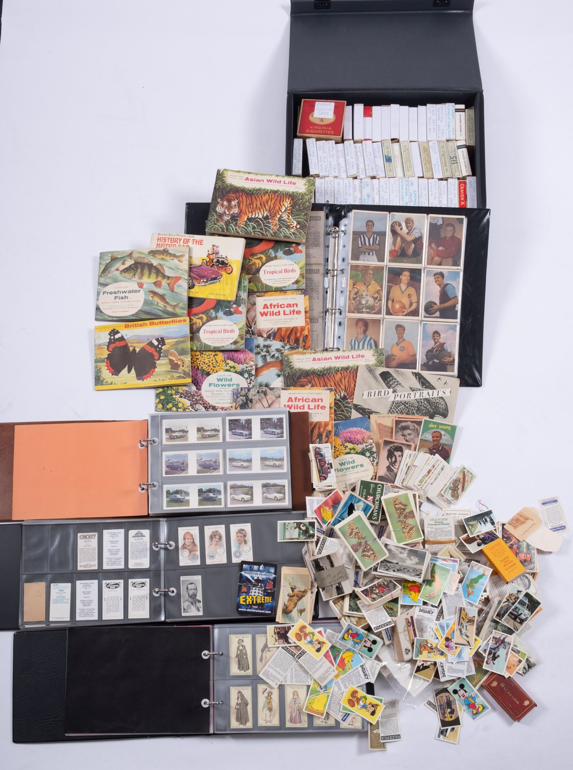 Cigarette and trade cards, an accumulation of sets and part sets in three albums,