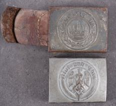 A German Army belt buckle and a Hitler Youth belt buckle.