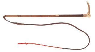 A Swaine & Adney 15ct gold mounted riding whip, London 1903,