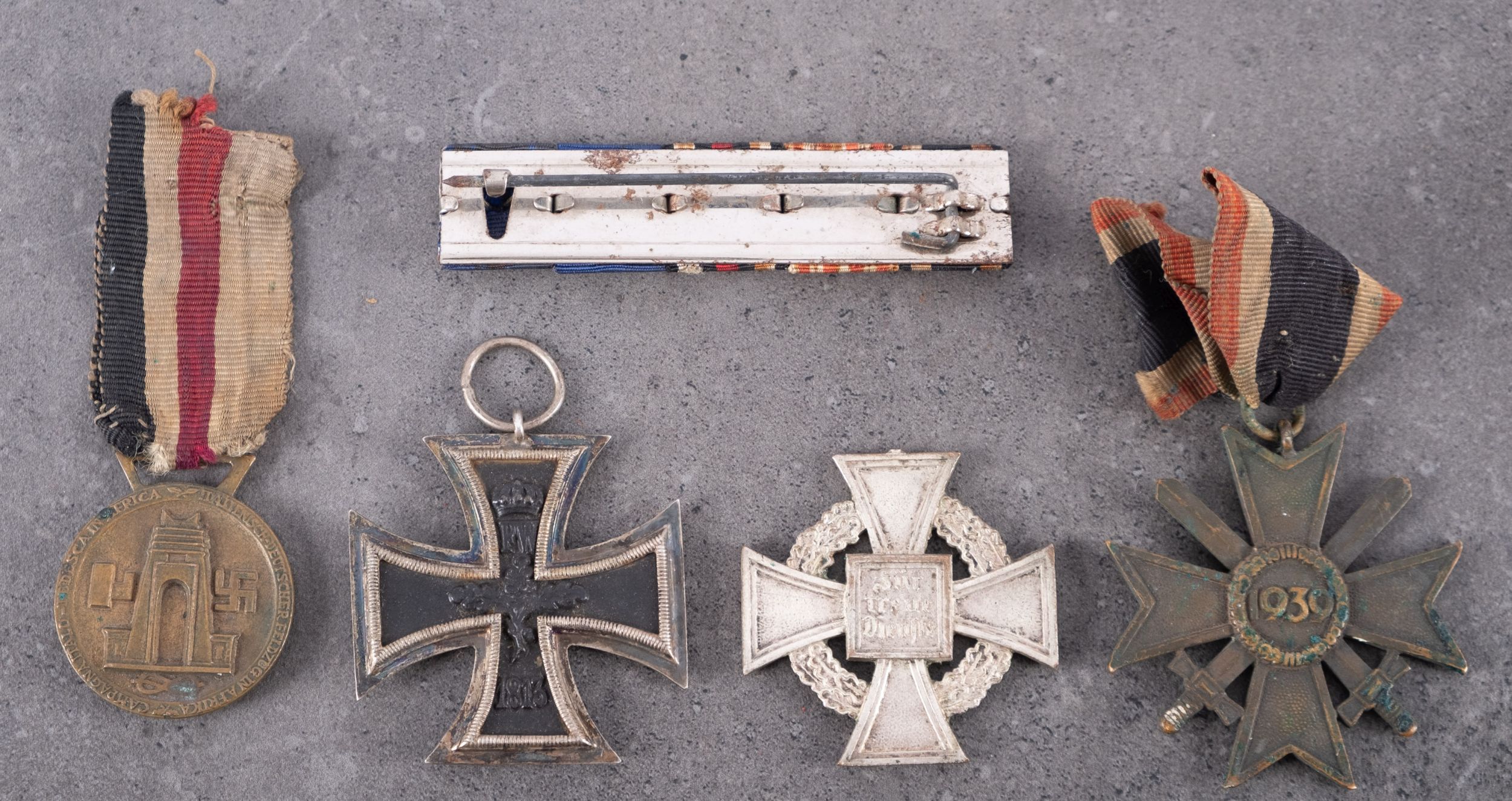 A WWI Iron Cross, second class, together with a WWII German/Italian North Africa Medal, - Image 2 of 2