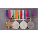 A WWII group of four, 1939-45 Star, Defence Medal, War Medal, and General Service Medal with clasp,