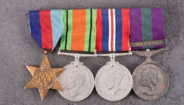 A WWII group of four, 1939-45 Star, Defence Medal, War Medal, and General Service Medal with clasp,