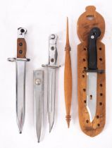 A British LIA3 pattern bayonet and scabbard together with two other display bayonets.