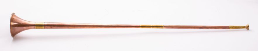 A copper and brass bound coaching horn with trumpet horn,