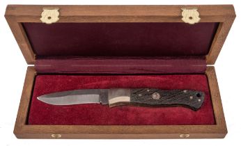 A Boker pocket knife with damascus blade and two piece wooden grips made from 3000 year old oak,