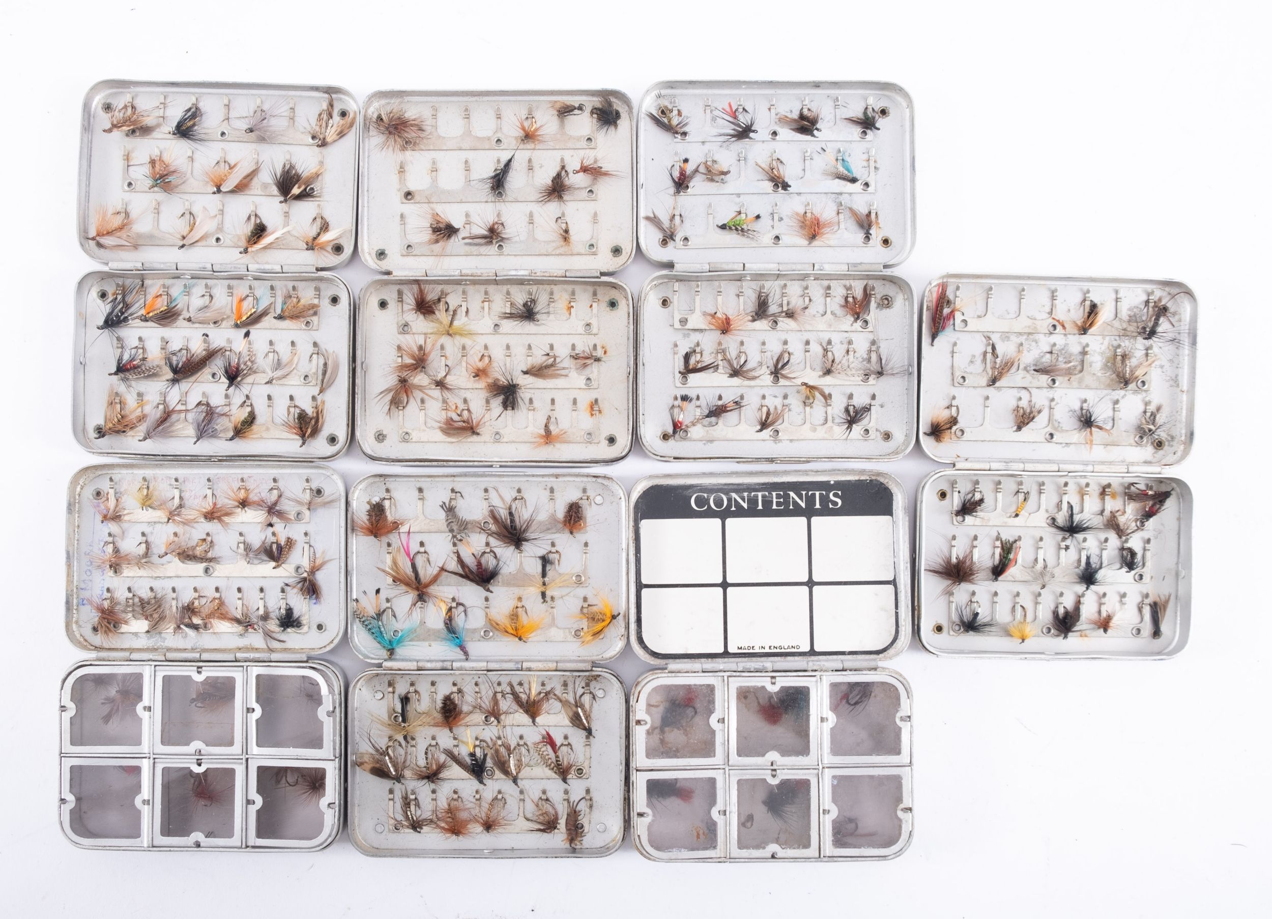 Seven Wheatley alloy Fly Fishing boxes containing mostly dry flies some wet,