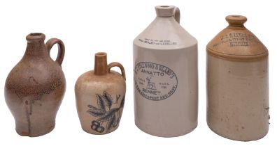 A group of four stoneware bottles, one stamped 'W&S Lucas Ltd Brewers & Spirit Merchants Hitchin',