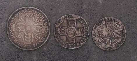 A 1671 Charles II 1/2 Crown, 1758 Shilling, 1787 Shilling.