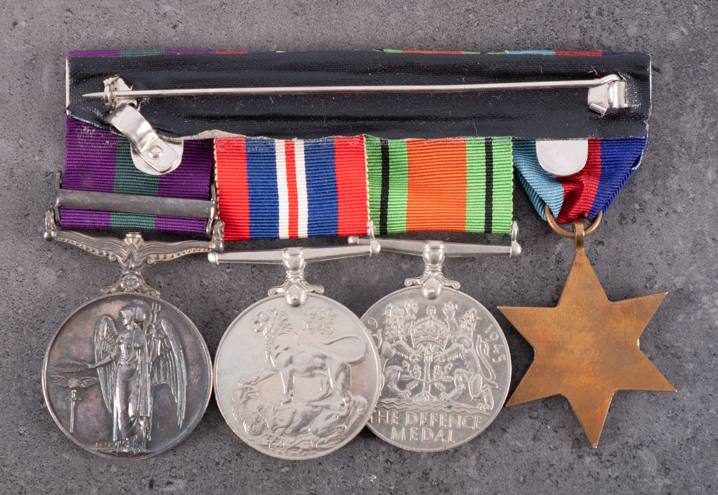 A WWII group of four, 1939-45 Star, Defence Medal, War Medal, and General Service Medal with clasp, - Image 2 of 2