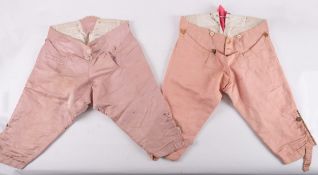 Two pairs of 18th-century gentleman's pink silk and satin breeches,