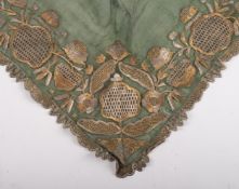 An Ottoman green silk shawl with gold and silver thread embroidery in floral designs,