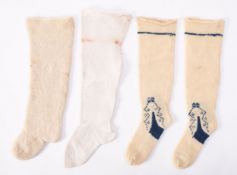 A pair of child's wool socks with blue embroidery; together with two single child's wool socks,