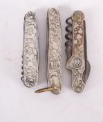 Three Art Nouveau ornate silver metal knives,