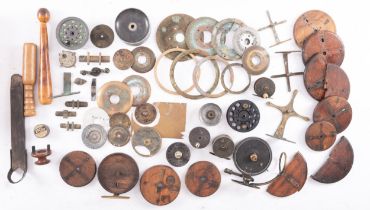 A collection of fishing reel parts, including an early Malloch side caster (broken),