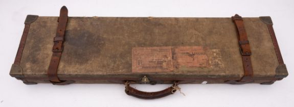 An early 20th century canvas and leather gun case, maker C B Vaughan.