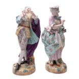 A pair of large late 19th century Continental porcelain figures of a gallant and companion wearing