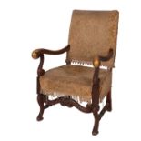 A carved walnut and upholstered elbow chair in William and Mary style,