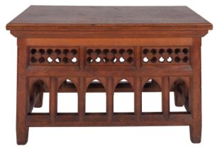 A Victorian oak side or centre table in Gothic style, late 19th century; the top with moulded edges,