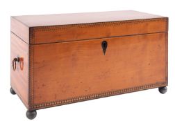 A satinwood and inlaid box, previously a tea caddy,