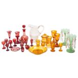 A mixed group of primarily Bohemian glass, comprising amber and ruby flashed goblets, glasses,