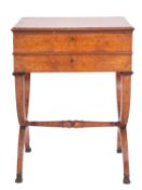 A Regency or George IV burr walnut work table, circa 1820; the hinged top with moulded edges,