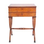 A Regency or George IV burr walnut work table, circa 1820; the hinged top with moulded edges,