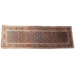 A Karaja runner, the pastel blue field with a repeated design of geometric flowering stems,