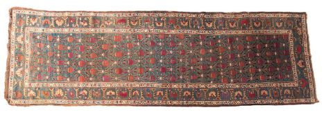 A Karaja runner, the pastel blue field with a repeated design of geometric flowering stems,
