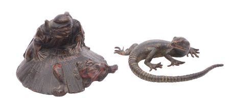 A Japanese patinated and bronzed metal okimono in the form of a warrior pursuing a shishi , 7.