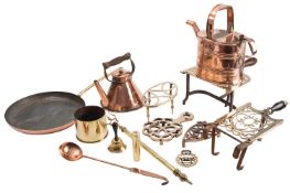 A collection of domestic metalware, 19th century; including five brass trivets,