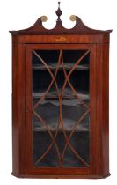 A George III mahogany and glazed hanging corner cabinet,