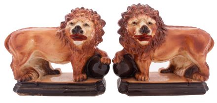 A pair of Staffordshire figures of Medici lions,