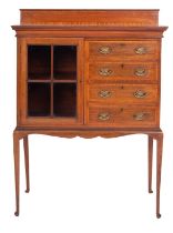 An Edwardian mahogany and cross banded side cabinet, early 20th century; with raised back,