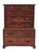 A stained hardwood, probably black walnut and oak chest on chest,