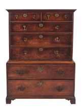 A stained hardwood, probably black walnut and oak chest on chest,
