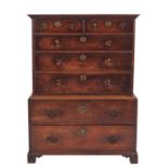 A stained hardwood, probably black walnut and oak chest on chest,